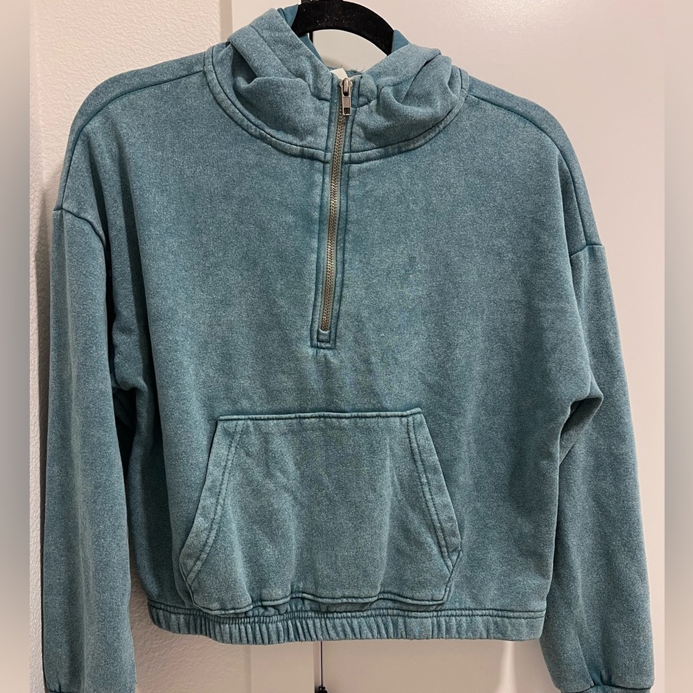 Junior turquoise crop sweater with zipper pockets